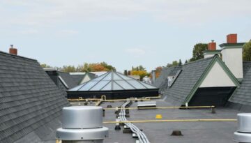 Flat roof with skylight and shingles