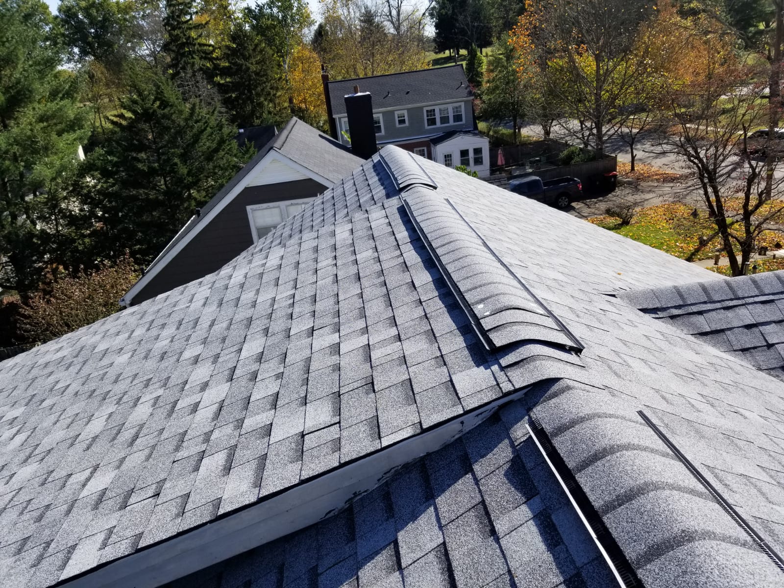 The top of a roof with new shingles