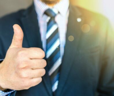 Man in business suit with thumbs up