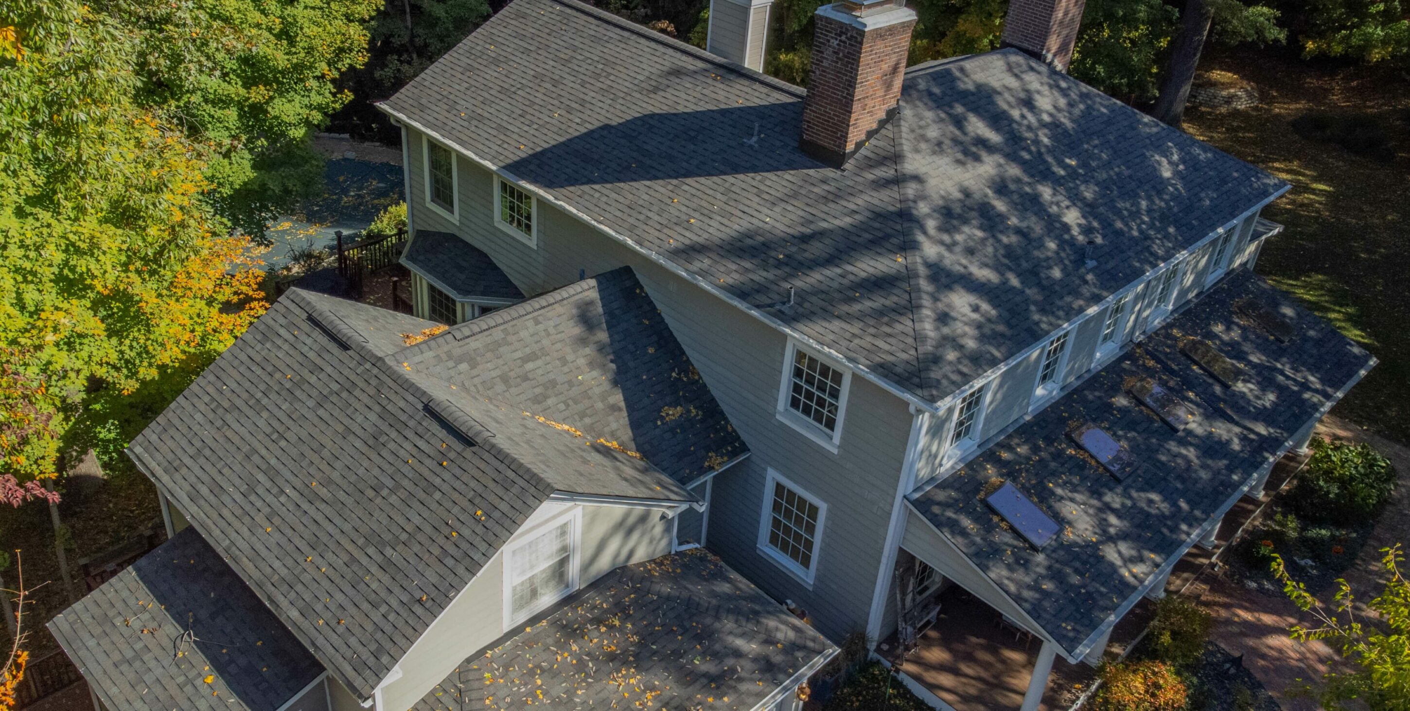 Aerial view of home with new roof replacement
